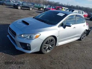 2016 Subaru WRX Premium with VIN JF1VA1E65G9810998, listed as a IAAI auction lot 41545599 with 123,135 mi miles. Bid and sale history available at carsss.com. Image 2.