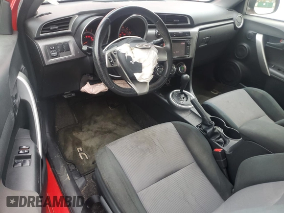 2014 Scion tC z VIN JTKJF5C79E3079305, wystawiony jako Copart lot #51750825 z przebiegiem 175 801 mil mil oraz Szkoda całkowita • Salvage title. Historia ofert i sprzedaży dostępna na DreamBid. Obrazek 8.