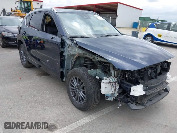 2020 Mazda CX-5 Touring with VIN JM3KFACM2L0856777, listed as a IAAI auction lot 42073972 with 151,628 mi miles. Bid and sale history available at carsss.com. Image 1.