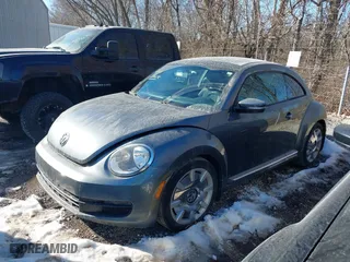 2012 Volkswagen Beetle 2.5L PZEV with VIN 3VWJP7AT0CM630116, listed as a IAAI auction lot 41401663 with 150,674 mi miles. Bid and sale history available at carsss.com. Image 2.