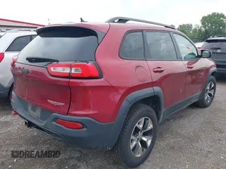 2015 Jeep Cherokee Trailhawk with VIN 1C4PJMBS6FW575517, listed as a IAAI auction lot 42661199 with 299,166 mi miles and . Bid and sale history available at DreamBid. Image 4.
