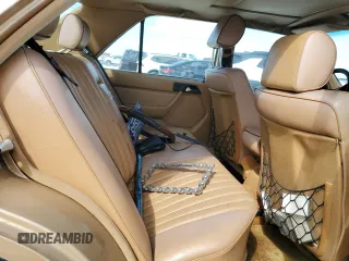 1986 Mercedes-Benz 300 300E with VIN WDBEA30D5GA296062, listed as a Copart auction lot 77434624 with 112,899 mi miles and Salvage Title. Bid and sale history available at carsss.com. Image 10.
