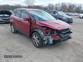 2016 Ford Escape Titanium with VIN 1FMCU9JX2GUA89716, listed as a IAAI auction lot 41899786 with 85,474 mi miles and . Bid and sale history available at DreamBid. Image 1.