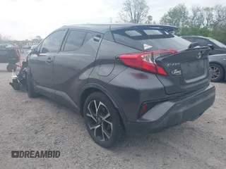 2018 Toyota C-HR XLE z VIN NMTKHMBX9JR044367, wystawiony jako IAAI lot #42116714 z przebiegiem 124 597 mil mil oraz . Historia ofert i sprzedaży dostępna na DreamBid. Obrazek 3.