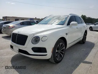2019 Bentley Bentayga V8 z VIN SJAAM2ZV0KC026362, wystawiony jako Copart lot #54059393 z przebiegiem 31 530 mil mil oraz . Historia ofert i sprzedaży dostępna na DreamBid. Obrazek 1.