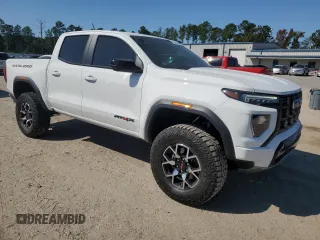 2023 GMC Canyon 4WD AT4X with VIN 1GTP6EEK6P1235222, listed as a Copart auction lot 75664684 with 9,736 mi miles and Salvage Title. Bid and sale history available at carsss.com. Image 4.