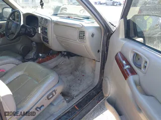 2001 Oldsmobile Bravada with VIN 1GHDT13W312117182, listed as a IAAI auction lot 41457726 with 160,288 mi miles. Bid and sale history available at carsss.com. Image 5.