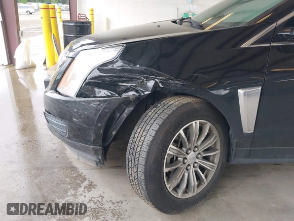 2014 Cadillac SRX Luxury Collection z VIN 3GYFNEE36ES677883, wystawiony jako IAAI lot #42260861 z przebiegiem 51 730 mil mil oraz . Historia ofert i sprzedaży dostępna na DreamBid. Obrazek 6.
