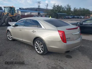 2014 Cadillac XTS Luxury z VIN 2G61M5S37E9304598, wystawiony jako IAAI lot #41006051 z przebiegiem 115 879 mil mil oraz . Historia ofert i sprzedaży dostępna na DreamBid. Obrazek 3.