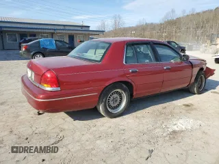 2001 Ford Crown Victoria LX z VIN 2FAFP74W41X205147, wystawiony jako Copart lot #46240035 z przebiegiem 65 495 mil mil oraz Szkoda całkowita • Salvage title. Historia ofert i sprzedaży dostępna na DreamBid. Obrazek 3.