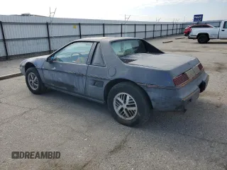 1985 Pontiac Fiero z VIN 1G2PM37R2FP239143, wystawiony jako Copart lot #45717405 z przebiegiem Nie podano mil oraz Tytuł czysty. Historia ofert i sprzedaży dostępna na DreamBid. Obrazek 2.
