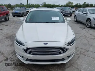 2017 Ford Fusion Titanium with VIN 3FA6P0K99HR272713, listed as a IAAI auction lot 41757334 with 104,733 mi miles. Bid and sale history available at carsss.com. Image 12.