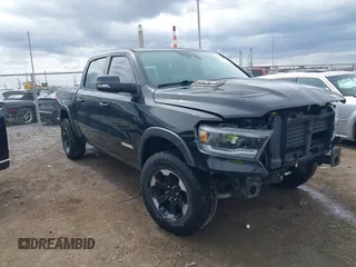2021 Ram 1500 Rebel with VIN 1C6SRFLT2MN594758, listed as a IAAI auction lot 41854893 with 54,012 mi miles and . Bid and sale history available at DreamBid. Image 1.