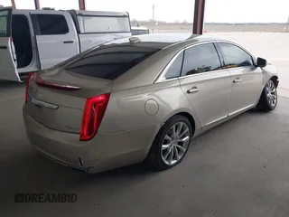 2015 Cadillac XTS Luxury z VIN 2G61M5S39F9246298, wystawiony jako IAAI lot #41555093 z przebiegiem 126 928 mil mil oraz . Historia ofert i sprzedaży dostępna na DreamBid. Obrazek 4.