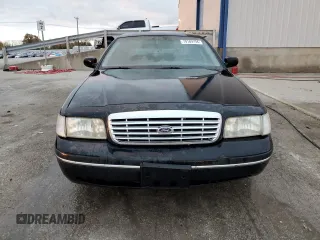 2000 Ford Crown Victoria LX z VIN 2FAFP74W3YX122481, wystawiony jako Copart lot #79189794 z przebiegiem 277 772 mil mil oraz Nie do naprawy • Non repairable. Historia ofert i sprzedaży dostępna na DreamBid. Obrazek 5.