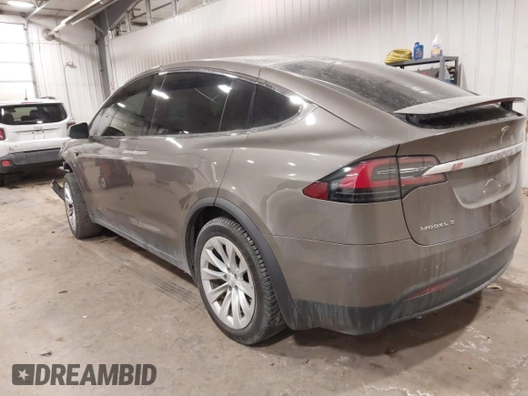 2016 Tesla Model X 70D with VIN 5YJXCBE27GF004974, listed as a IAAI auction lot 41630556 with 167,709 mi miles. Bid and sale history available at carsss.com. Image 3.