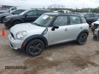 2011 MINI Countryman S with VIN WMWZC5C51BWM10385, listed as a IAAI auction lot 41952679 with 112,008 mi miles and . Bid and sale history available at DreamBid. Image 2.