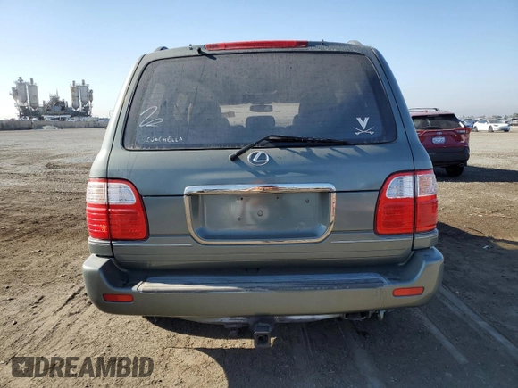 2002 Lexus LX 470 z VIN JTJHT00W723519186, wystawiony jako Copart lot #70190464 z przebiegiem 306 793 mil mil oraz Tytuł czysty. Historia ofert i sprzedaży dostępna na DreamBid. Obrazek 6.