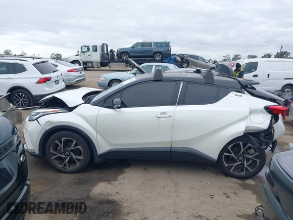 2020 Toyota C-HR LE with VIN JTNKHMBX9L1092934, listed as a IAAI auction lot 42021972 with 56,777 mi miles and . Bid and sale history available at DreamBid. Image 14.