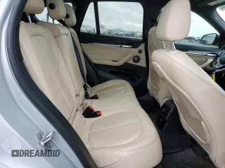 2017 BMW X1 sDrive28i with VIN WBXHU7C33H5H34013, listed as a Copart auction lot 38409444 with 87,558 mi miles and Salvage Title. Bid and sale history available at carsss.com. Image 10.
