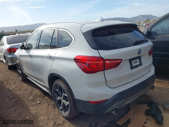2018 BMW X1 sDrive28i with VIN WBXHU7C32J5H41587, listed as a IAAI auction lot 41538394 with 125,804 mi miles. Bid and sale history available at carsss.com. Image 3.