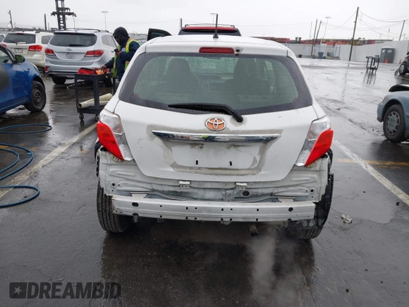 2014 Toyota Yaris L with VIN JTDJTUD34ED576939, listed as a IAAI auction lot 41805971 with 234,406 mi miles. Bid and sale history available at carsss.com. Image 6.