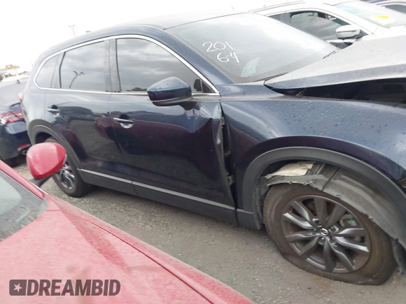 2021 Mazda CX-9 Touring with VIN JM3TCACY9M0526880, listed as a IAAI auction lot 42310923 with 25,991 mi miles and . Bid and sale history available at DreamBid. Image 14.