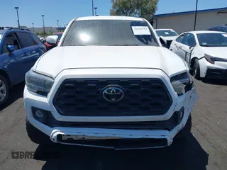 2023 Toyota Tacoma SR with VIN 3TMCZ5AN4PM558760, listed as a IAAI auction lot 42626514 with 39,335 mi miles and . Bid and sale history available at DreamBid. Image 12.