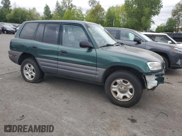 1999 Toyota RAV4 with VIN JT3GP10V2X0037464, listed as a Copart auction lot 54732085 with 306,550 mi miles and Clean Title. Bid and sale history available at DreamBid. Image 4.