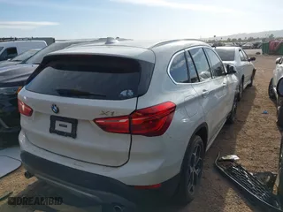 2018 BMW X1 sDrive28i with VIN WBXHU7C32J5H41587, listed as a IAAI auction lot 41538394 with 125,804 mi miles. Bid and sale history available at carsss.com. Image 4.