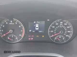 2020 Kia Optima LX with VIN 5XXGT4L37LG445597, listed as a IAAI auction lot 42404651 with 56,851 mi miles and . Bid and sale history available at DreamBid. Image 7.
