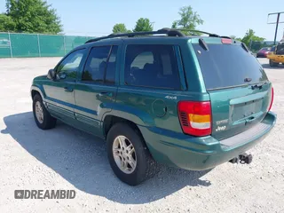 1999 Jeep Grand Cherokee Limited z VIN 1J4GW68N5XC630910, wystawiony jako IAAI lot #42380978 z przebiegiem 188 300 mil mil oraz . Historia ofert i sprzedaży dostępna na DreamBid. Obrazek 3.