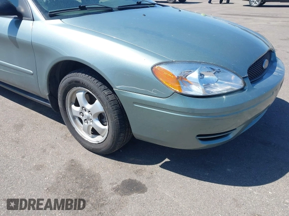 2005 Ford Taurus SE with VIN 1FAFP53U05A273576, listed as a IAAI auction lot 42140404 with 58,735 mi miles. Bid and sale history available at carsss.com. Image 6.