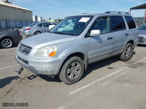 2003 Honda Pilot EX with VIN 2HKYF18443H571688, listed as a IAAI auction lot 42097297 with 313,910 mi miles. Bid and sale history available at carsss.com. Image 2.