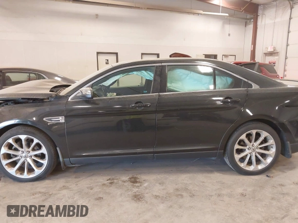 2014 Ford Taurus Limited z VIN 1FAHP2J88EG112614, wystawiony jako IAAI lot #42135220 z przebiegiem 70 409 mil mil oraz . Historia ofert i sprzedaży dostępna na DreamBid. Obrazek 14.