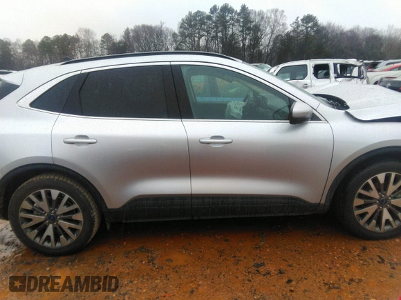 2020 Ford Escape Titanium Hybrid with VIN 1FMCU0DZ8LUB13911, listed as a IAAI auction lot 41249498 with 64,108 mi miles and . Bid and sale history available at DreamBid. Image 13.