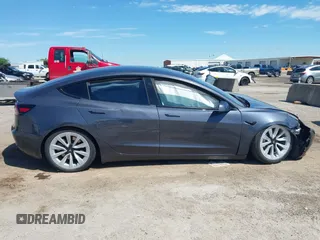 2023 Tesla Model 3 with VIN 5YJ3E1EAXPF617388, listed as a IAAI auction lot 42218748 with Not provided miles and . Bid and sale history available at DreamBid. Image 13.