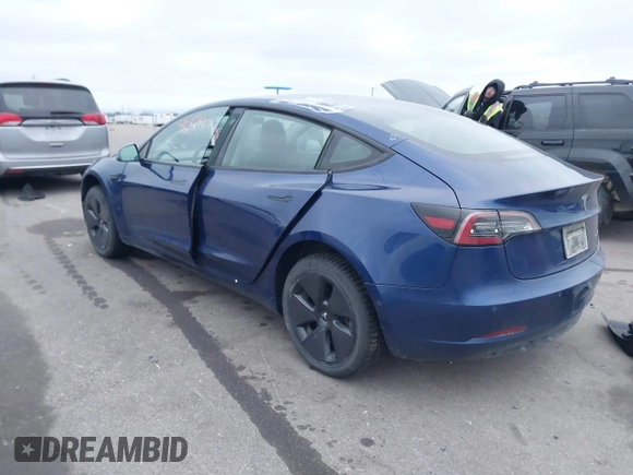2021 Tesla Model 3 Long Range with VIN 5YJ3E1EB8MF848049, listed as a IAAI auction lot 40974331 with 61,462 mi miles. Bid and sale history available at carsss.com. Image 3.