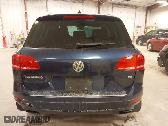 2014 Volkswagen Touareg Sport with VIN WVGEF9BP9ED008967, listed as a IAAI auction lot 41984409 with 193,859 mi miles and . Bid and sale history available at DreamBid. Image 16.