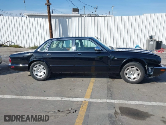 2003 Jaguar XJ 8 with VIN SAJDA14C03LF58706, listed as a IAAI auction lot 41619740 with 95,293 mi miles and . Bid and sale history available at DreamBid. Image 13.