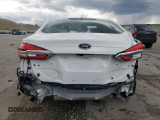 2020 Ford Fusion SE z VIN 3FA6P0T9XLR138977, wystawiony jako Copart lot #55260085 z przebiegiem 92 470 mil mil oraz Szkoda całkowita • Salvage title. Historia ofert i sprzedaży dostępna na DreamBid. Obrazek 6.