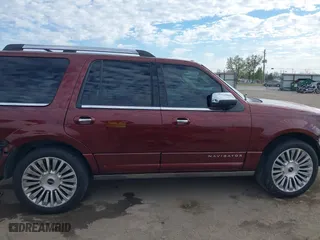2015 Lincoln Navigator with VIN 5LMJJ2JT4FEJ12021, listed as a IAAI auction lot 41880471 with 104,979 mi miles. Bid and sale history available at carsss.com. Image 14.