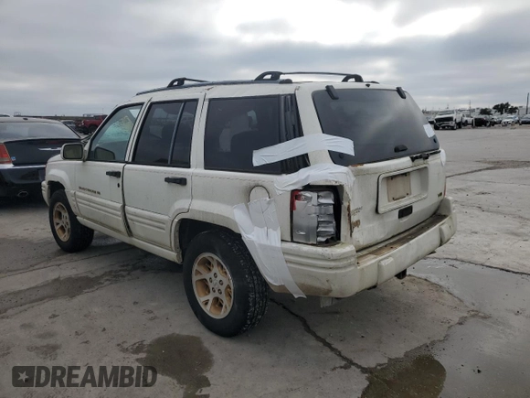 1997 Jeep Grand Cherokee Limited with VIN 1J4GX78YXVC716353, listed as a Copart auction lot 85207974 with 115,527 mi miles and Salvage Title. Bid and sale history available at carsss.com. Image 2.