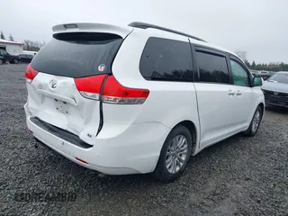 2014 Toyota Sienna XLE with VIN 5TDYK3DC2ES485846, listed as a IAAI auction lot 41693092 with 106,156 mi miles and . Bid and sale history available at DreamBid. Image 4.