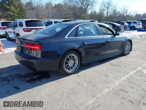 2017 Audi A8 L Sport with VIN WAU43AFDXHN003685, listed as a IAAI auction lot 41264314 with 114,828 mi miles. Bid and sale history available at carsss.com. Image 4.
