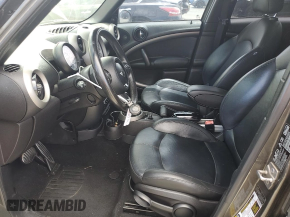 2011 MINI Countryman S with VIN WMWZC5C5XBWL55516, listed as a Copart auction lot 63239235 with 137,545 mi miles and Salvage title. Bid and sale history available at DreamBid. Image 7.