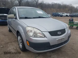 2009 Kia Rio LX with VIN KNADE243596544181, listed as a IAAI auction lot 41876733 with 200,216 mi miles. Bid and sale history available at carsss.com. Image 1.