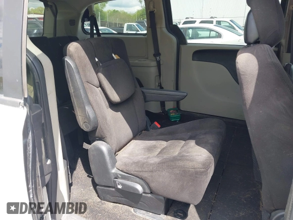 2014 Dodge Grand Caravan SXT with VIN 2C4RDGCG8ER264027, listed as a IAAI auction lot 42018350 with 311,876 mi miles and . Bid and sale history available at DreamBid. Image 8.
