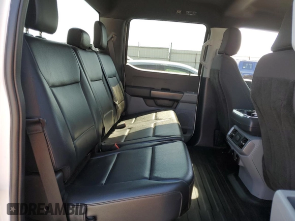 2023 Ford F-150 Lightning Pro with VIN 1FT6W1EVXPWG44972, listed as a Copart auction lot 60303485 with 19,788 mi miles and Salvage title. Bid and sale history available at DreamBid. Image 10.