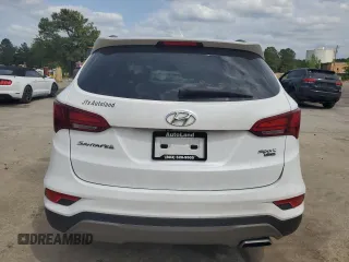 2018 Hyundai Santa Fe 2.4L z VIN 5NMZUDLB9JH095157, wystawiony jako Copart lot #53546725 z przebiegiem 128 840 mil mil oraz Szkoda całkowita • Salvage title. Historia ofert i sprzedaży dostępna na DreamBid. Obrazek 6.